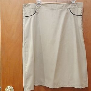 Mislook tan skirt with black piping outline of faux pocket